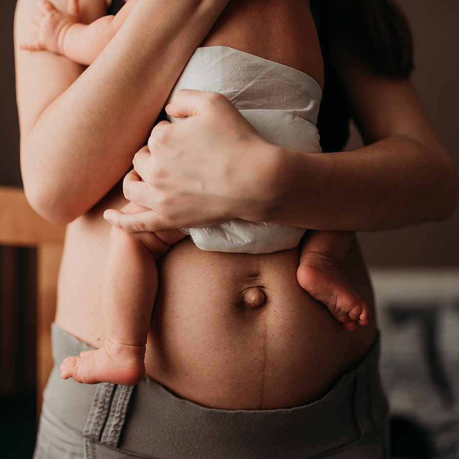 Woman holding newborn baby
